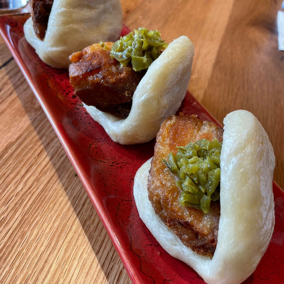 Pai Men Miyake signature dishes Paitan Ramen, Spicy Miso Ramen, Pork Buns, Miyake-Dressed Brussels Sprouts
